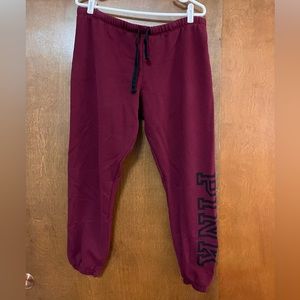 Wine colored PINK sweatpants. Banded at the ankle. Functional drawstring